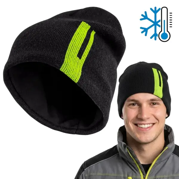 CZAPKA LOKI CZARNA Czarna czapka zimowa z jaskrawozielonym paskiem, pokazana pod kątem ukazującym czarne wnętrze oraz założona na uśmiechniętym modelu w szarej kurtce roboczej, z niebieską ikoną termometru i śnieżynki, wycięte na białym tle studyjnym.