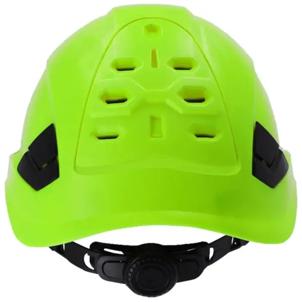 Hełm ochronny SALLET NEON - widok z tyłu ukazujący jaskrawożółtą skorupę z otworami wentylacyjnymi, czarne boczne sloty na akcesoria oraz czarne pokrętło do regulacji obwodu na dole - wycięte na białym tle studyjnym.